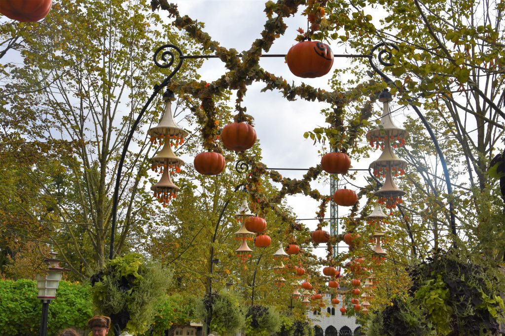 Pumpkins hanging above the path entrance at Tivoli Gardens in Copenhagen